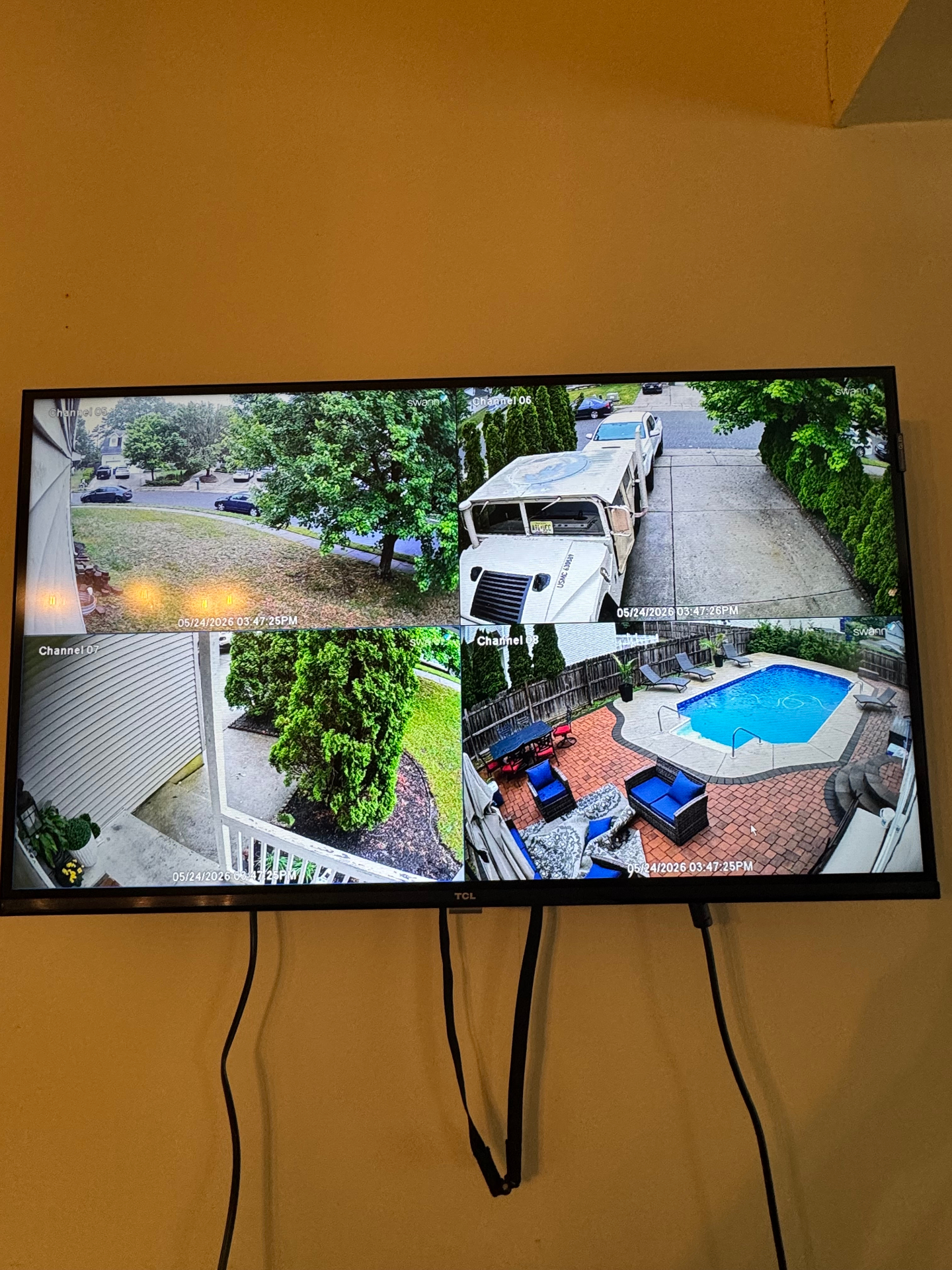 In-home multi-channel security camera display showing live property views